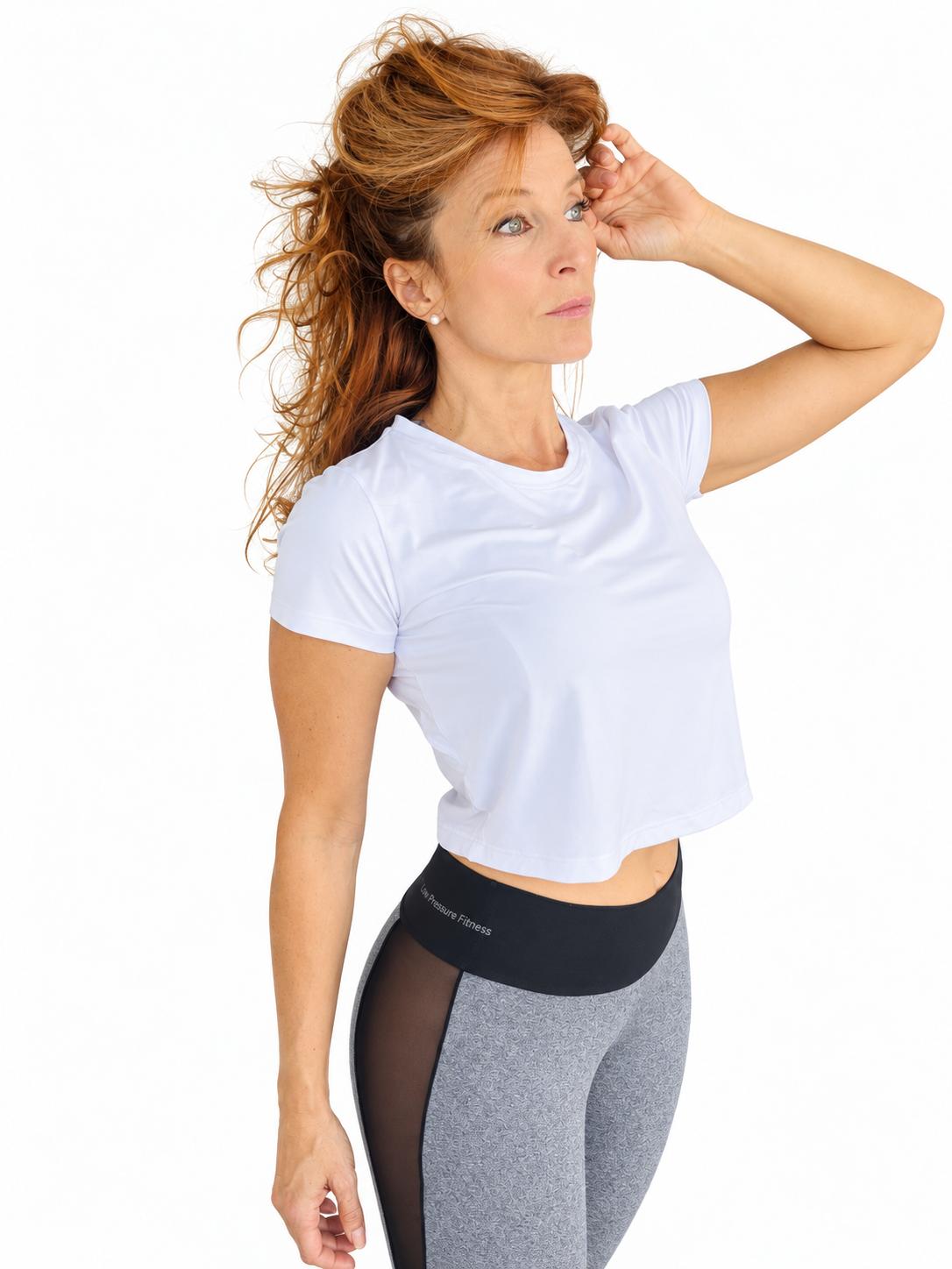 White cropped T-shirt worn with Elements Earth leggings